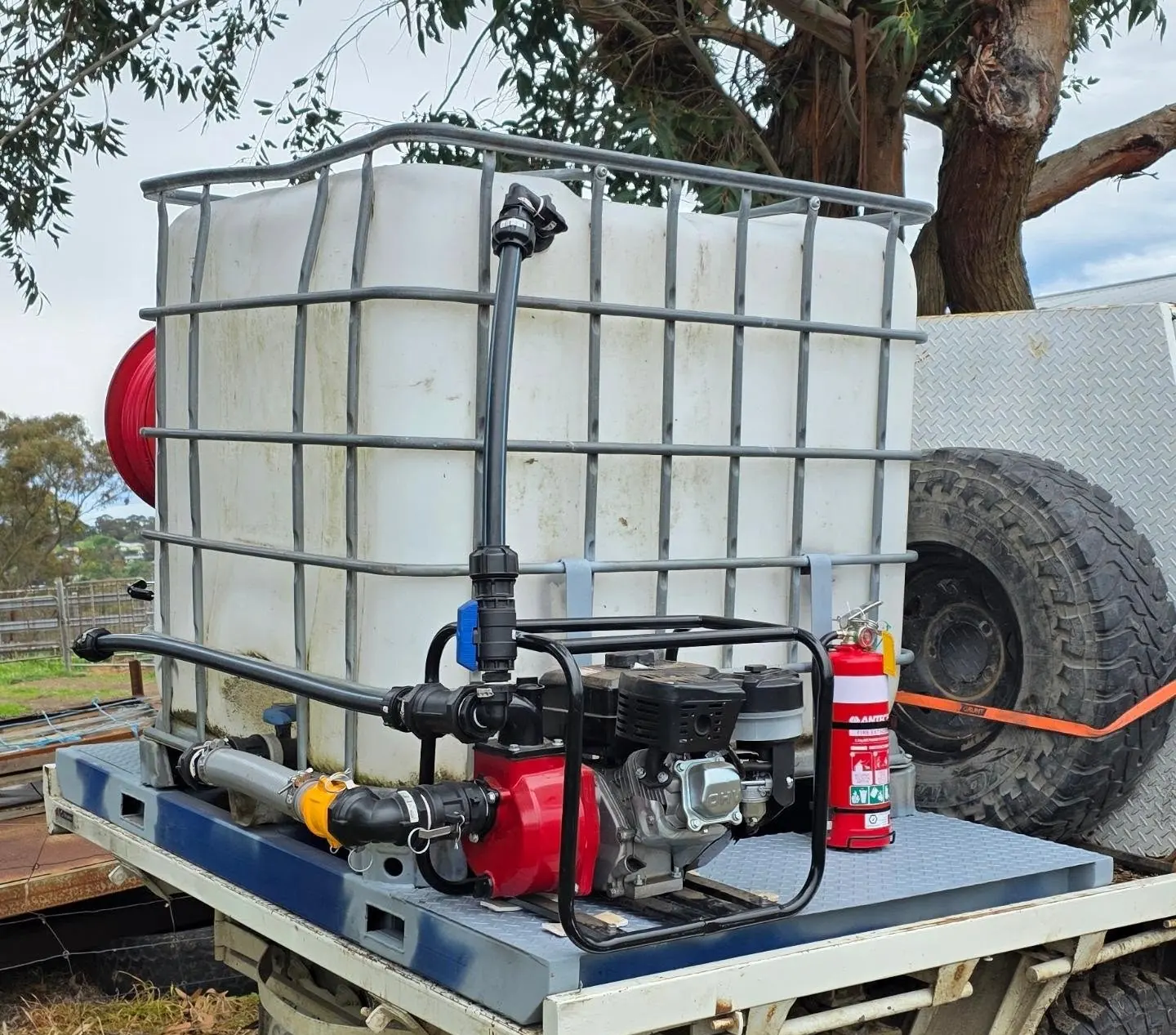 Firefighting skid unit strapped onto a white ute tray
